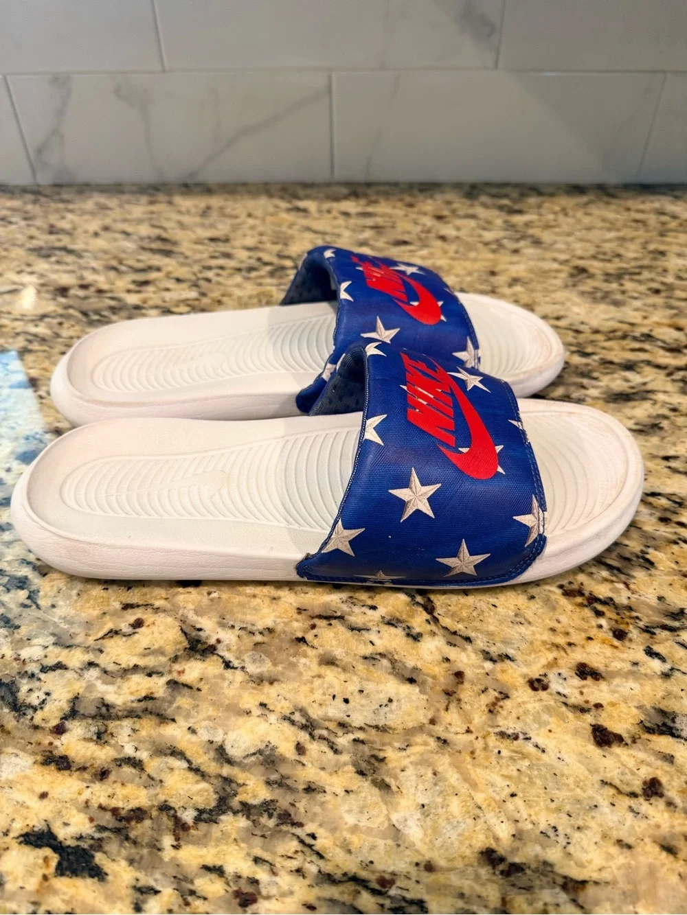 Nike Men’s White Slide Sandals with Blue Star Strap